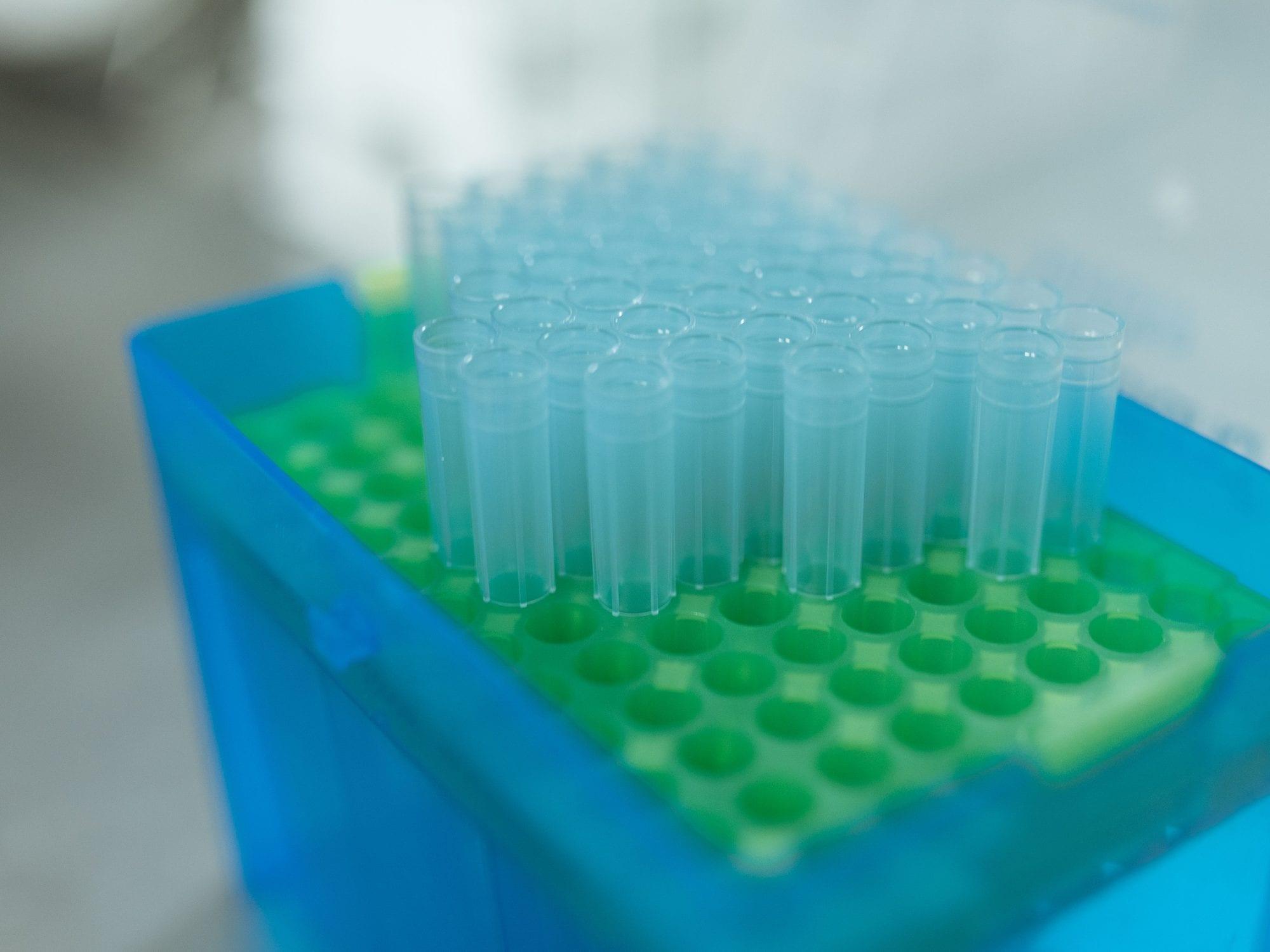 A rack of empty sample vials on a laboratory bench