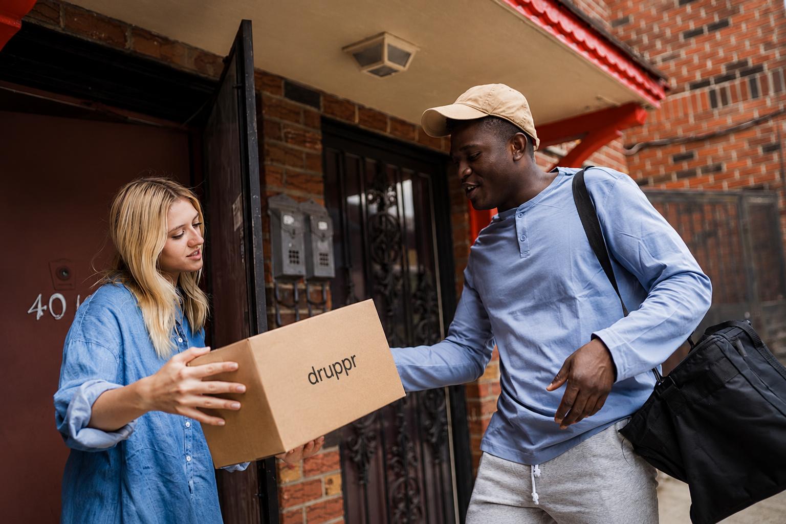 A customer receiving a Druppr package at a doorway.